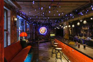 Garage Bar at Bobby Hotel Nashville – edgy underground bar with neon lights, graffiti-covered walls, vintage jukebox, and eclectic decor in downtown Nashville.